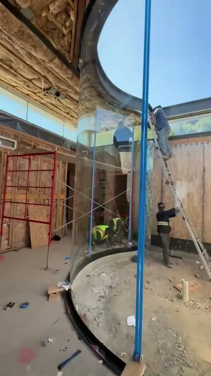 Curved glass wall installation in progress, Los Angeles commercial project