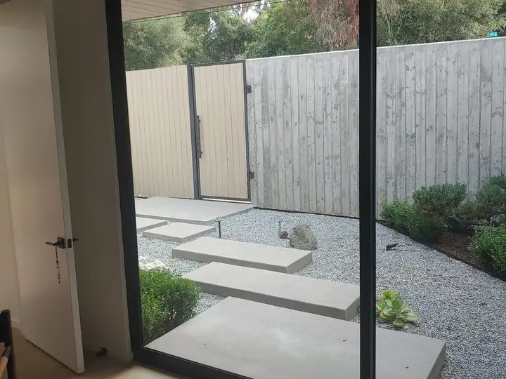 Fleetwood EDGE sliding door opening to a garden patio in Los Angeles