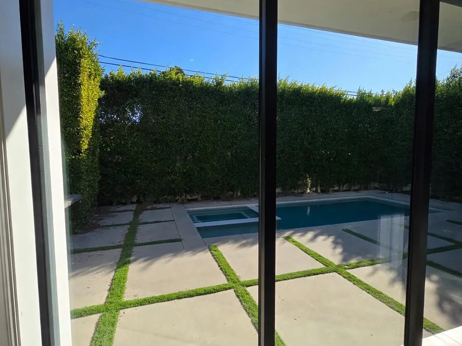 Fleetwood sliding door overlooking a pool courtyard