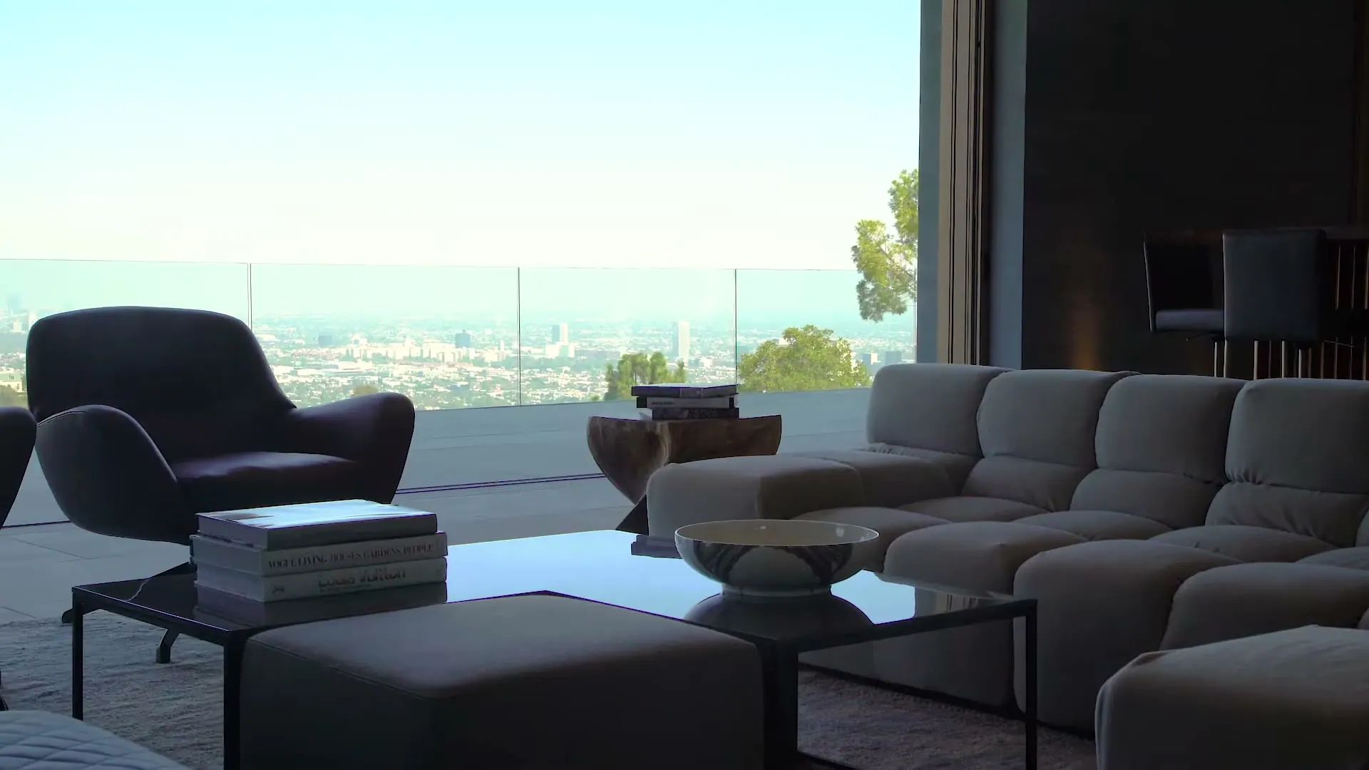 Glass-walled living space with a frameless glass balcony railing at 1520 Gilcrest Drive, Beverly Hills, glazing by Versa Glass Co.