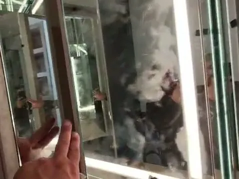 Swing-out mirror panel on a backlit vanity installation, Los Angeles