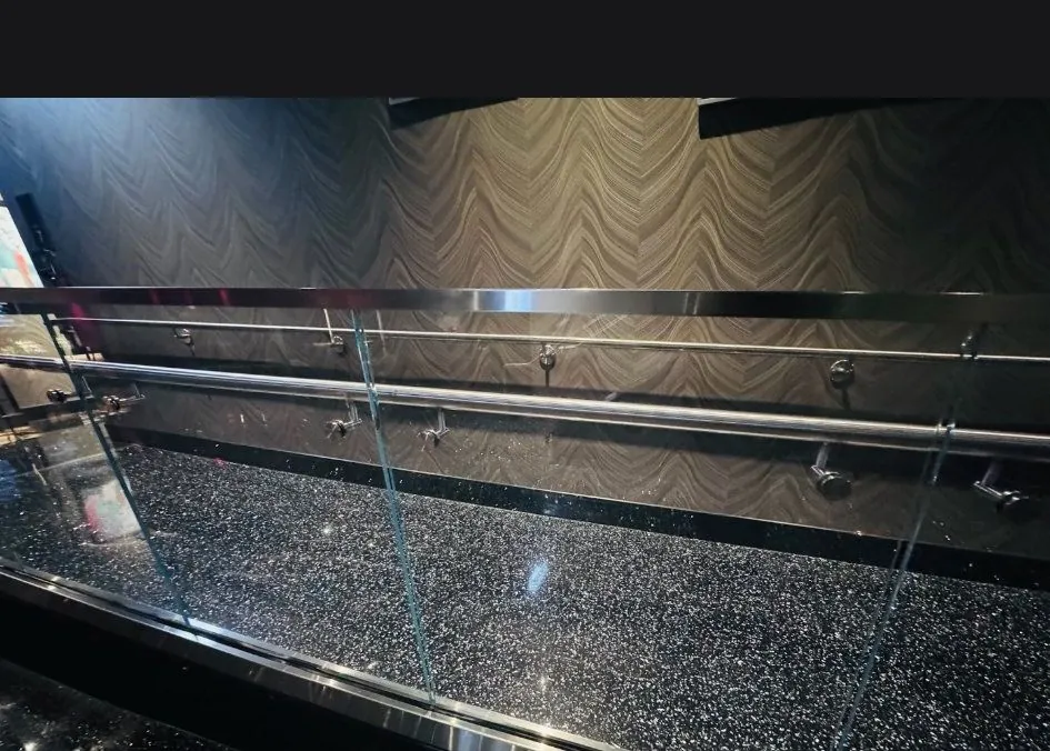 Commercial interior glass guardrail installed by Versa Glass Co.