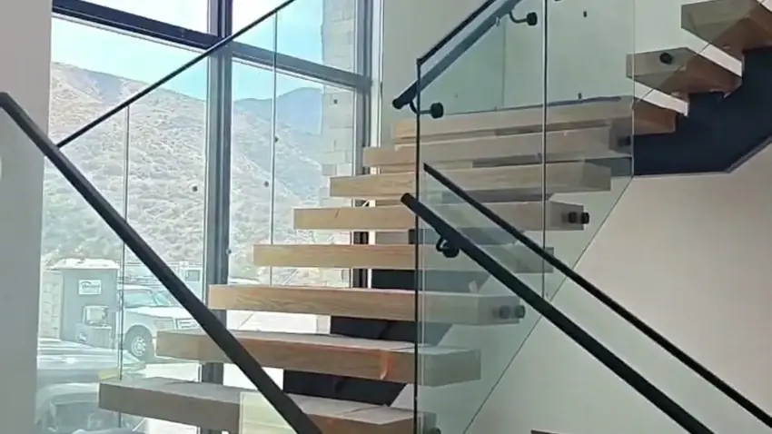 Frameless glass railing on a floating staircase in Los Angeles