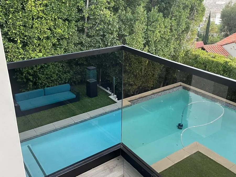 Frameless glass pool fence on a Los Angeles view property